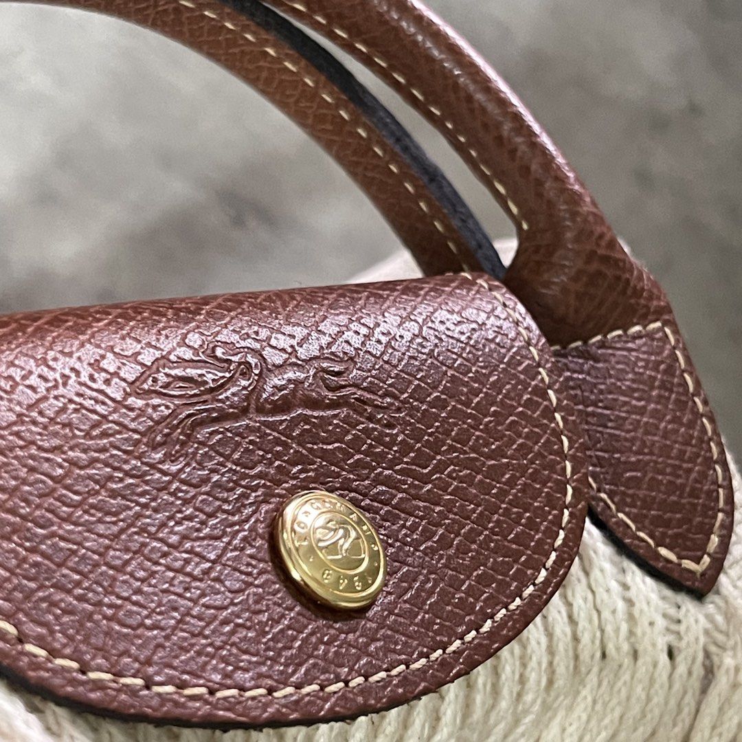 Authentic Original Longchamp Filet Large Net Tote Bag Ecru (Category: Luxury Bags & Wallets) located in General Trias. Submitted by abellu (Listing ID 1461869312, Image 2). Description: Selling to feed more bellies 🐾 Proceeds go to my rescue dogs, cats & strays. Please respect the price, no much haggling. Thank you - Authentic used once only - With Longchamp paperbag - Color: Ecru - Beige knit with brown leather handles and trim - Features class