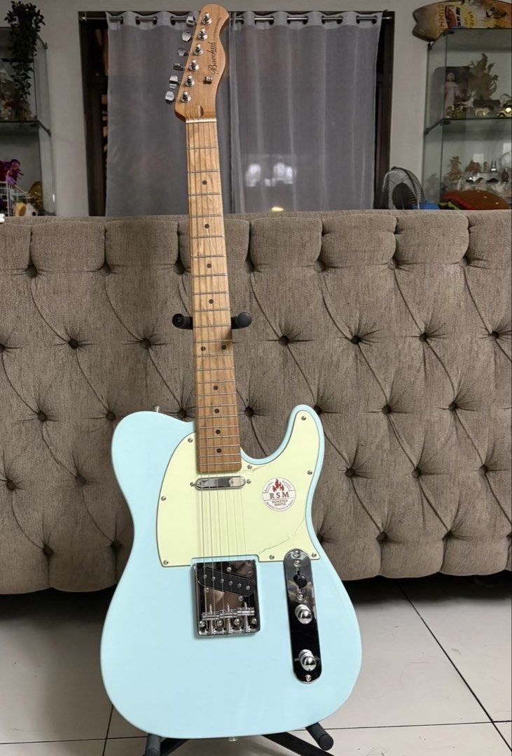 Bacchus RSM Roasted Maple Telecaster Style Electric Guitar (Category: Musical Instruments) located in Pasig City. Submitted by sinta_studio (Listing ID 1462006078, Image 1). Description: Bacchus Telecaster-style electric guitar in light blue. Features a roasted maple neck. Great for playing or collecting..