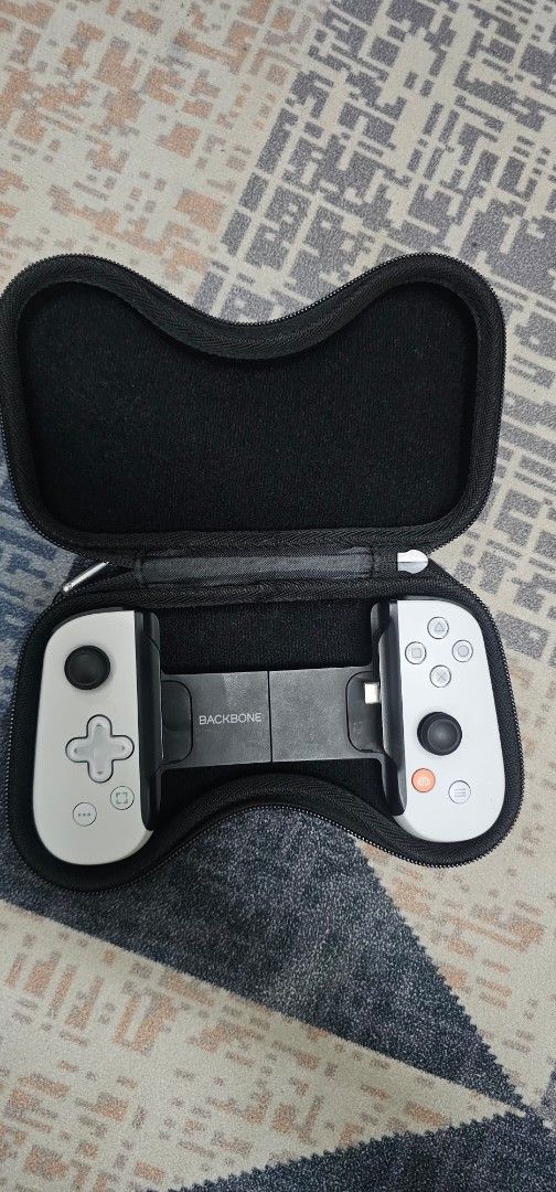 Backbone One Controller for iPhone / Android type C (Category: Controllers) located in Putrajaya. Submitted by nadzrinrosman (Listing ID 1461892184, Image 1). Description: - Backbone One controller for iPhone - Connects via Type C - Includes original carrying case - Ideal for mobile gaming on your iPhone COD Putrajaya.