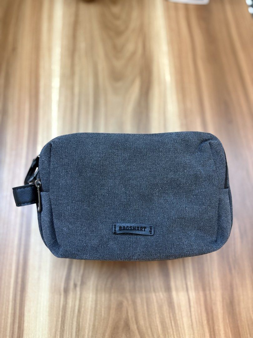 BAGSMART Grey Canvas Pouch (Category: Purses & Pouches) located in Manila. Submitted by amityclutter (Listing ID 1461938366, Image 1). Description: - Brand: BAGSMART - Color: Grey - Material: Canvas - Features: Black leather zipper pull accent, small leather brand tag - Use: Ideal for organizing toiletries or small essentials - Size: Compact and easy to carry.
