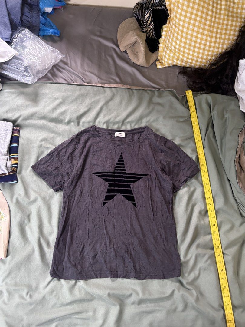 BEAMS T-shirt with Black Star Graphic (Category: Blouses) located in Andop. Submitted by ukaylangpo (Listing ID 1461853749, Image 1). Description: EXCELLENT CONDITION 17x22 - Brand: BEAMS - Color: Grey - Design: Bold black star graphic on front, small star details on back - Style: Short sleeves, classic crew neck - Condition: Comfortable everyday tee - Note: Measurements available upon request.