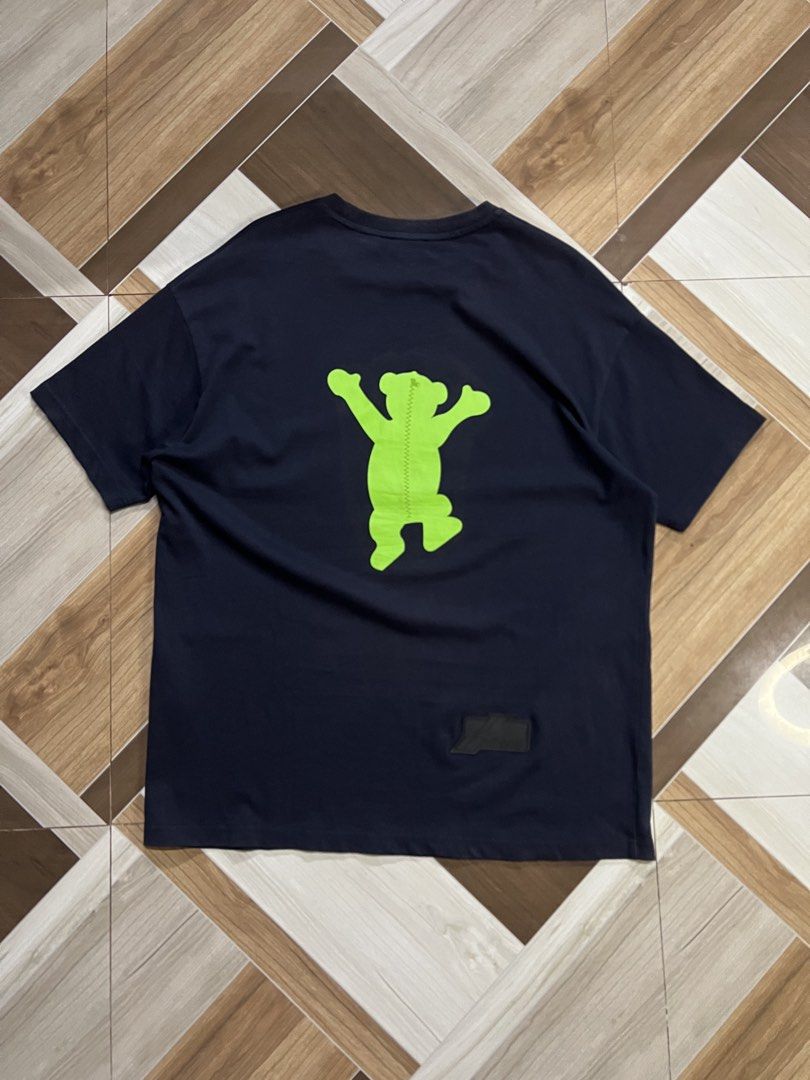Bear Graphic T-Shirt (Category: Shirts) located in Manila. Submitted by cleverrabbit-6e21 (Listing ID 1461800092, Image 1). Description: - Navy blue t-shirt - Features a bright green bear graphic with a stitched look - Graphic present on both front and back - Comfortable and casual design - Ideal for everyday wear.