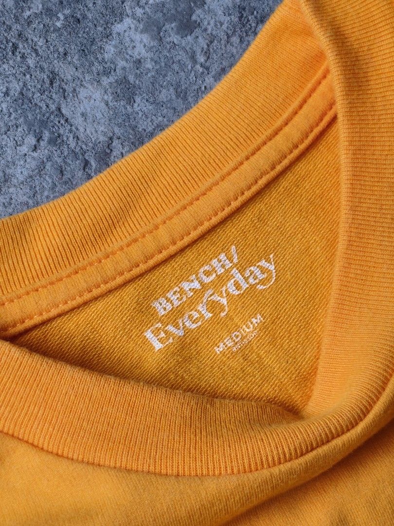 BENCH Everyday Yellow Crewneck Sweatshirt (Category: Coats, Jackets and Outerwear) located in Cavite. Submitted by benta.ni.jm (Listing ID 1461808669, Image 2). Description: Size: M Dimensions: 23 x 29.5 Condition: 10/10 Color Rate: 10/10 Issue: 📩📩📩.