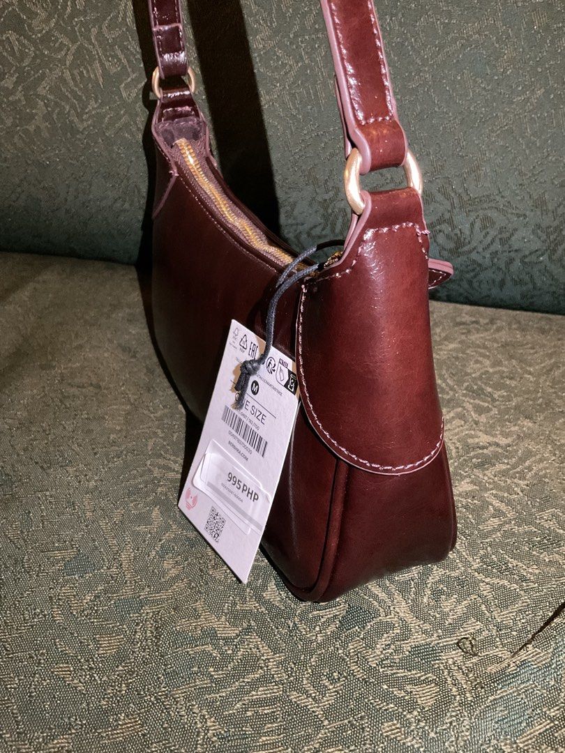 Bershka Leather Effect Brown Shoulder Bag (Category: Shoulder Bags) located in Las Pinas. Submitted by kateanne419 (Listing ID 1461988555, Image 2). Description: Brand new Bershka brown shoulder bag with shiny finish. Features zip closure, single strap, and original tag attached. One size..