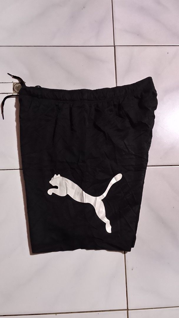 Big Logo Puma Shorts (Category: Shorts) located in Cavite. Submitted by ara.thrifts (Listing ID 1461814187, Image 1). Description: - Black Puma shorts - Size XXL width "17" length "21.5-22" no issue as new crispy pa 10/10 cr - Large white Puma logo on front - Elastic waistband with drawstring - Comfortable and durable material - Perfect for sports or casual wear.