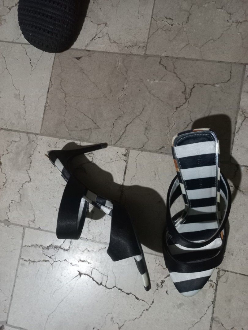 Black and White Striped Heeled Sandals (Category: Heels) located in Quezon City. Submitted by msdcshop (Listing ID 1461913405, Image 3). Description: - Stylish black and white striped heeled sandals - Open toe design - Two straps across the foot - Elegant stiletto heel - Ideal for dressing up your look.