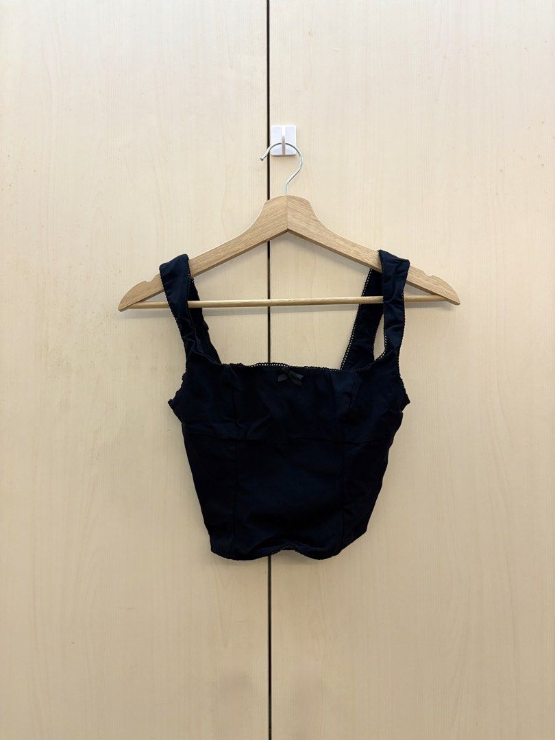Bershka Black Corset Top with Lace Trim (Category: Others Tops) located in Manila. Submitted by amityclutter (Listing ID 1461945653, Image 1). Description: - Black corset top - Sweetheart neckline - Lace trim along the top edge - Small bow detail in the center - Versatile for dressing up or down.