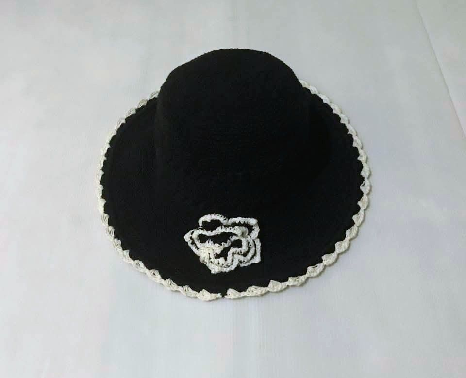 Black Crochet Hat w/ White Flower Accent (Category: Hats & Beanies) located in Pasig City. Submitted by kuhkuh (Listing ID 1461843149, Image 1). Description: Black crochet hat w/ white-edging flower accessory UNused ● wired brim ● removable flower accessory Unique, one-of-a-kind design Ideal for beach days, gardening, or any outdoor activity.
