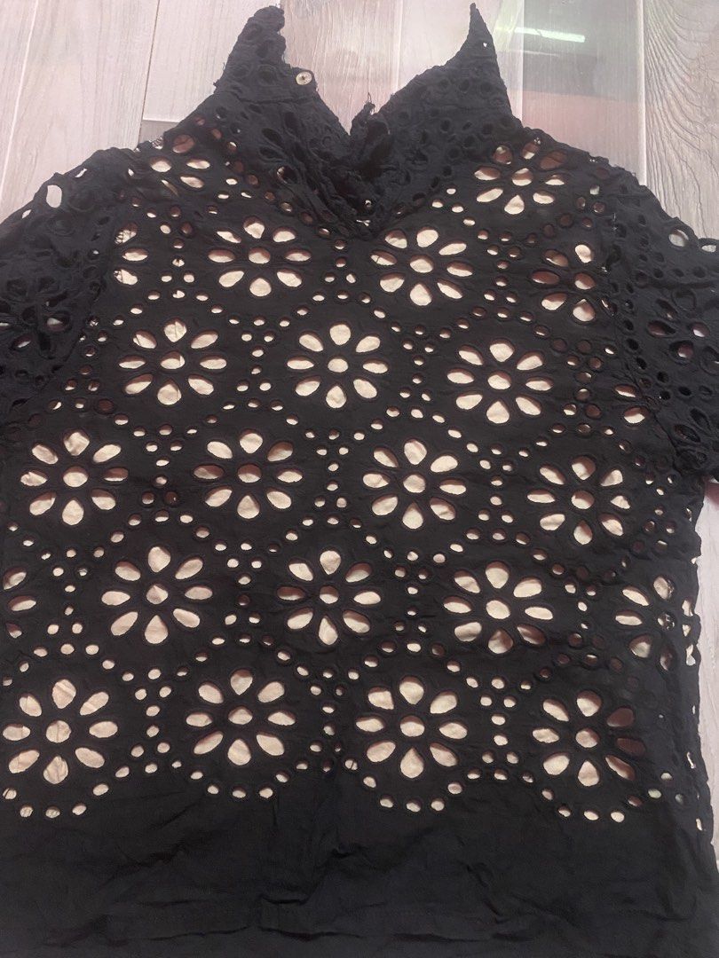 Black Eyelet Lace High-Neck Blouse (Category: Activewear) located in Manila. Submitted by kenthriftt (Listing ID 1461991696, Image 2). Description: Size Small Add a touch of vintage elegance to your wardrobe with this Black Eyelet Lace High-Neck Blouse! Featuring intricate floral cutouts (broderie anglaise) and a sophisticated mock-neck design, this top brings a romantic, boho-chic vibe to any outfit. It includes a soft inner lining on the torso 