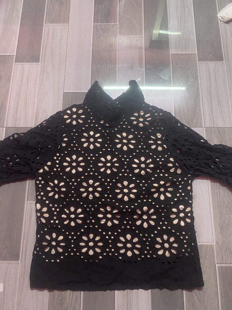 Black Eyelet Lace High-Neck Blouse (Category: Activewear) located in Manila. Submitted by kenthriftt (Listing ID 1461991696, Image 3). Description: Size Small Add a touch of vintage elegance to your wardrobe with this Black Eyelet Lace High-Neck Blouse! Featuring intricate floral cutouts (broderie anglaise) and a sophisticated mock-neck design, this top brings a romantic, boho-chic vibe to any outfit. It includes a soft inner lining on the torso 