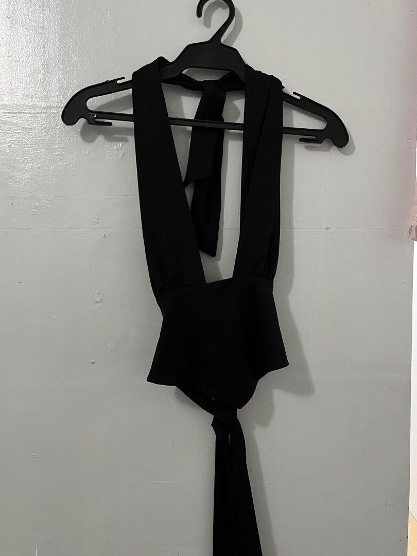 Black Halter Neck Tie Back Peplum Top (Category: Sleeveless) located in Antipolo. Submitted by starraid777 (Listing ID 1461853316, Image 1). Description: - Black halter neck top - Ties at the back and neck for adjustable fit - Flattering peplum waist - Deep V-neckline - Ideal for nights out and parties - Chic and stylish design.