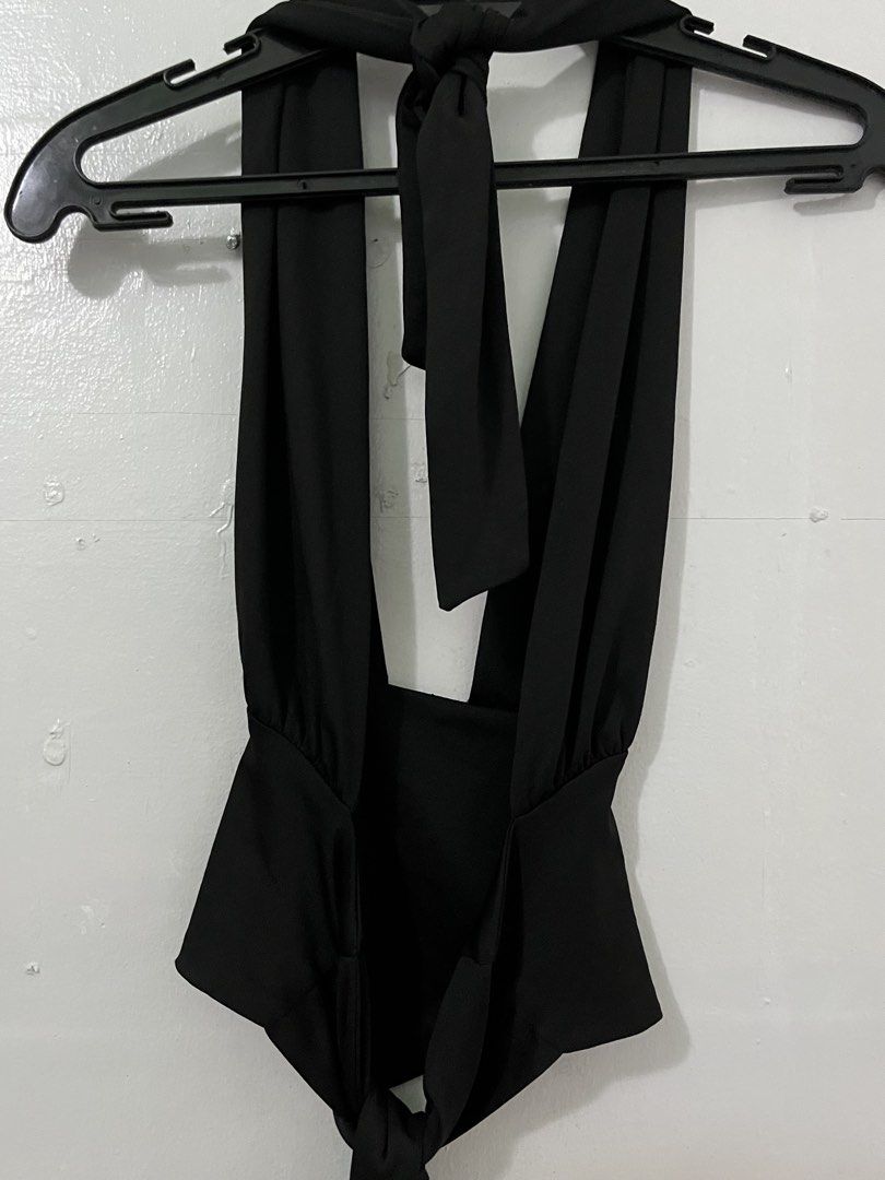 Black Halter Neck Tie Back Peplum Top (Category: Sleeveless) located in Antipolo. Submitted by starraid777 (Listing ID 1461853316, Image 2). Description: - Black halter neck top - Ties at the back and neck for adjustable fit - Flattering peplum waist - Deep V-neckline - Ideal for nights out and parties - Chic and stylish design.