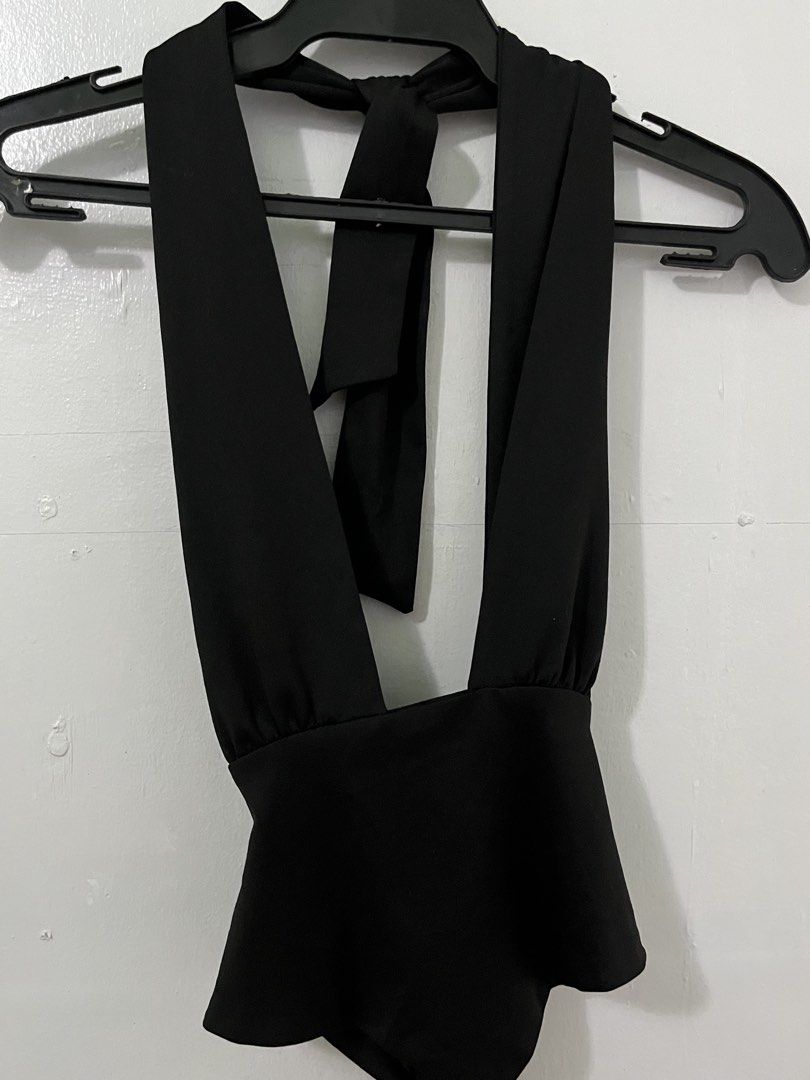 Black Halter Neck Tie Back Peplum Top (Category: Sleeveless) located in Antipolo. Submitted by starraid777 (Listing ID 1461853316, Image 3). Description: - Black halter neck top - Ties at the back and neck for adjustable fit - Flattering peplum waist - Deep V-neckline - Ideal for nights out and parties - Chic and stylish design.