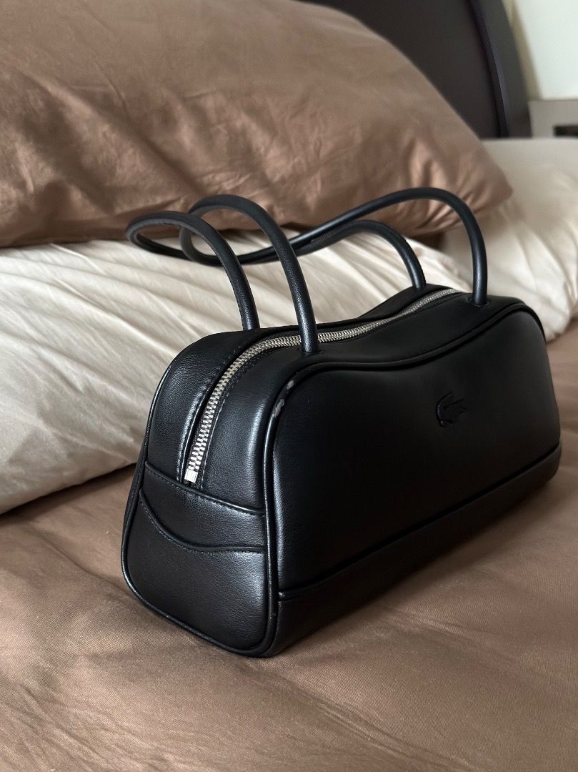 Black Lacoste Shoulder Bag (Category: Shoulder Bags) located in Caloocan City. Submitted by _heyfranz (Listing ID 1461845892, Image 3). Description: - Classic black shoulder bag from Lacoste - Simple and sleek design - Zipper opens to main compartment - Comfortable shoulder straps - Great for everyday use - Versatile and goes with everything.