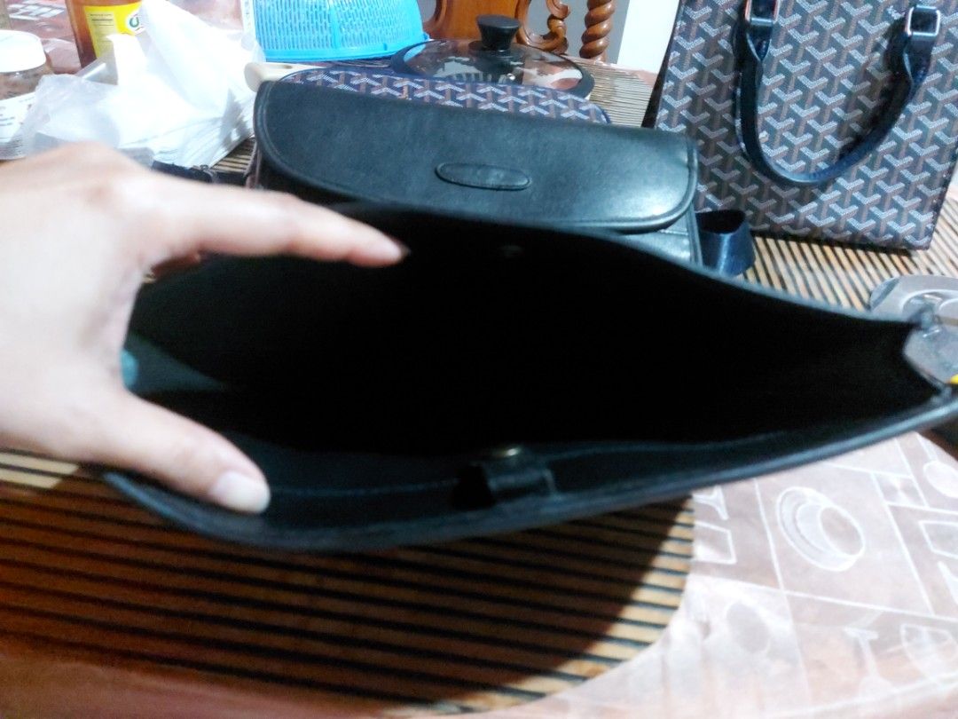 Black Leather Portfolio with Embossed Logo (Category: Briefcases) located in Manila. Submitted by veelafiera (Listing ID 1461860510, Image 3). Description: - Classic black leather portfolio - Secure flap closure with embossed logo - Minor scuffs and marks from normal use - Ideal for carrying documents or a tablet - Timeless design -Perfect for documents -Dimensions approx 11.5"x8.5".