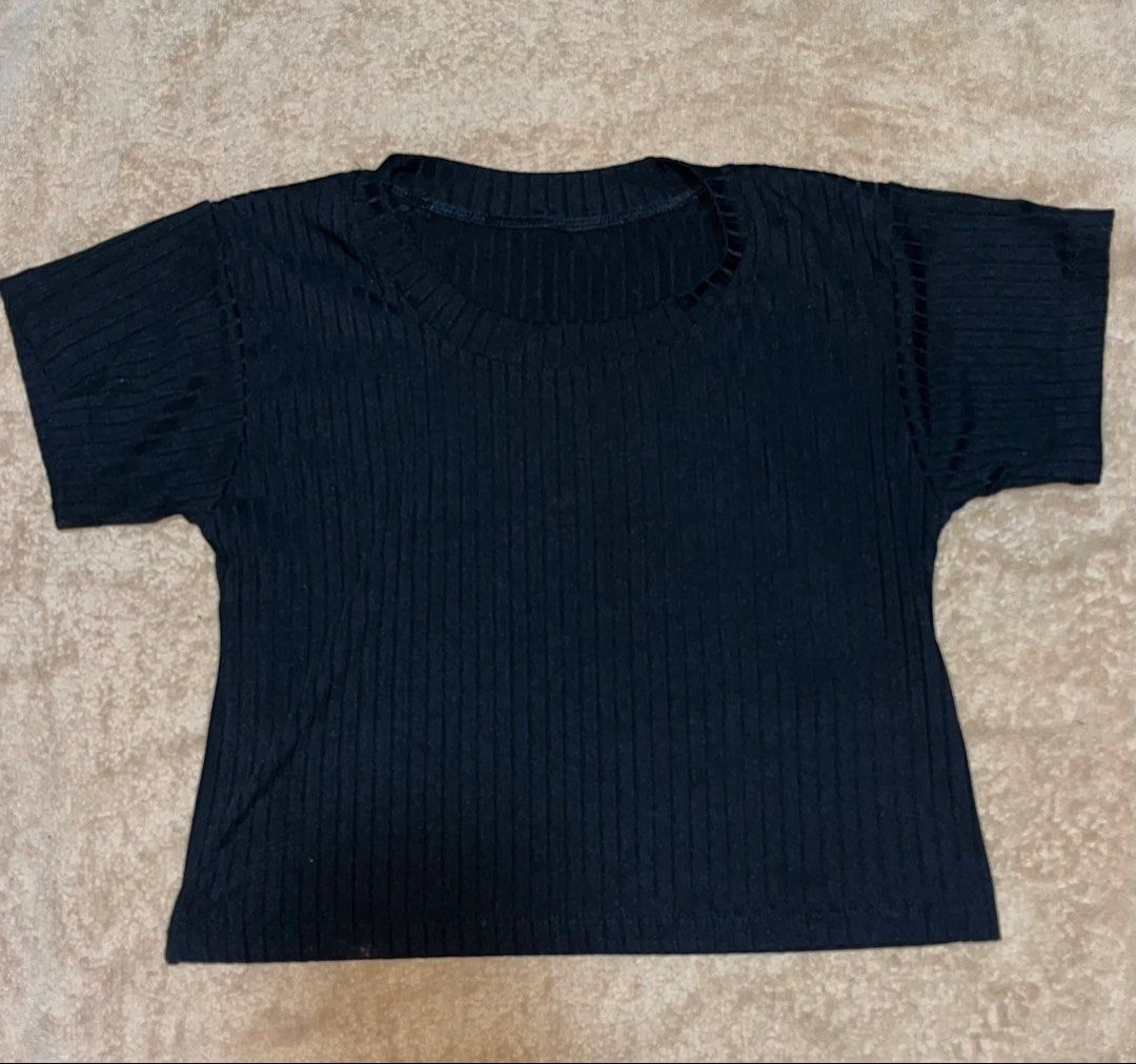 Black Ribbed Cropped T-shirt (Category: Shirts) located in Baguio. Submitted by pacola_fits (Listing ID 1461991118, Image 1). Description: - Black ribbed cropped t-shirt - Short sleeves - Round neckline - Stretchy fabric for comfort - Versatile for casual styling - Pairs well with high-waisted bottoms.