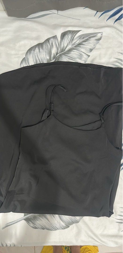 Black Satin Slip Dress with Adjustable Straps (Category: Dresses) located in Quezon City. Submitted by yuzenbro (Listing ID 1461977809, Image 1). Description: - Simple black slip dress - Made of shiny satin material - Features adjustable spaghetti straps - Versatile: great for layering or wearing alone - Comfortable and stylish.