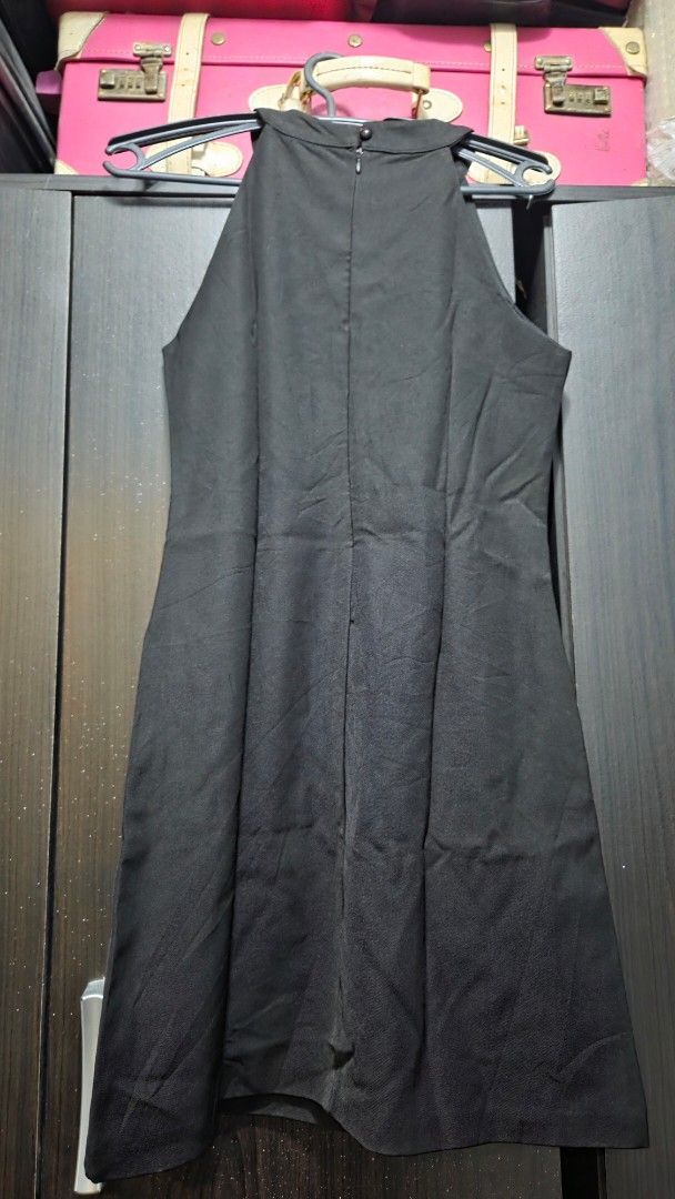 Black Sleeveless High Neck Dress (Category: Dresses) located in Quezon City. Submitted by kctheexplorer05 (Listing ID 1461929752, Image 2). Description: - Simple black sleeveless dress - Elegant high neckline with button closure at the back - Fabric has a slight sheen - Perfect staple piece for any wardrobe - Easy to dress up or down.