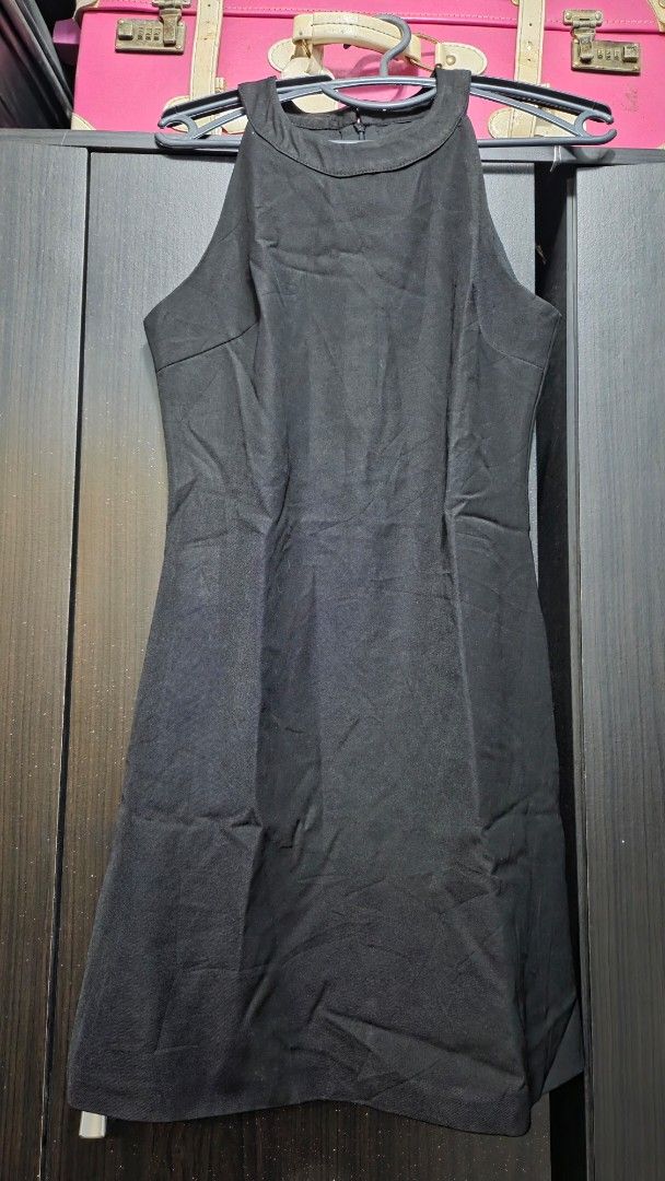 Black Sleeveless High Neck Dress (Category: Dresses) located in Quezon City. Submitted by kctheexplorer05 (Listing ID 1461929752, Image 1). Description: - Simple black sleeveless dress - Elegant high neckline with button closure at the back - Fabric has a slight sheen - Perfect staple piece for any wardrobe - Easy to dress up or down.