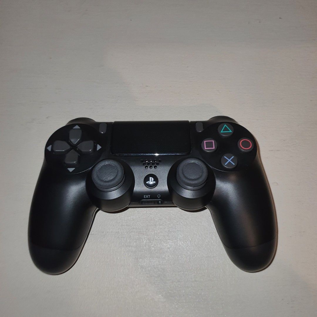 Black Sony PlayStation 4 DualShock 4 Controller (Category: Controllers) located in Pasig City. Submitted by mr.bargaindeal (Listing ID 1461798528, Image 1). Description: - Black Sony PlayStation 4 DualShock 4 Controller - Fully functional: All buttons and joysticks are responsive - Perfect for your next gaming session.