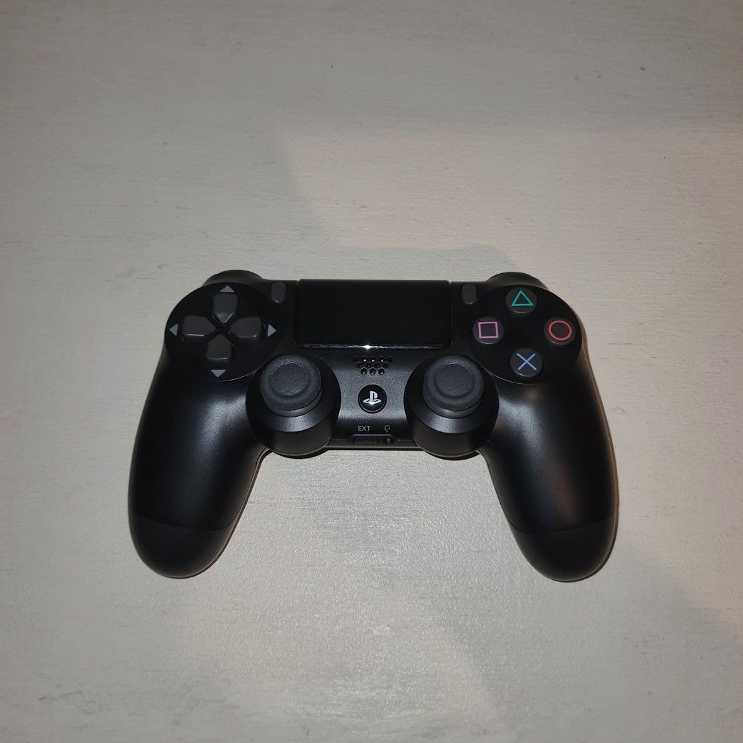 Black Sony PlayStation 4 DualShock 4 Controller (Category: Controllers) located in Pasig City. Submitted by mr.bargaindeal (Listing ID 1461798528, Image 3). Description: - Black Sony PlayStation 4 DualShock 4 Controller - Fully functional: All buttons and joysticks are responsive - Perfect for your next gaming session.