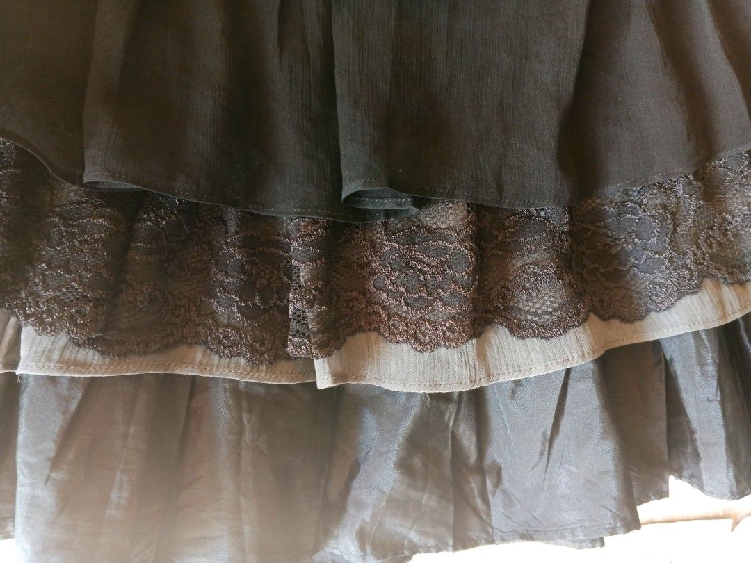 Y2K Black tiered lace trim skirt (Category: Skirts) located in Manila. Submitted by icamalicdem29 (Listing ID 1461899604, Image 3). Description: - Black skirt with tiered layers - Delicate lace trim on each tier - Made from a flowy material - Perfect for dressing up or down - Easy to pair with various tops.