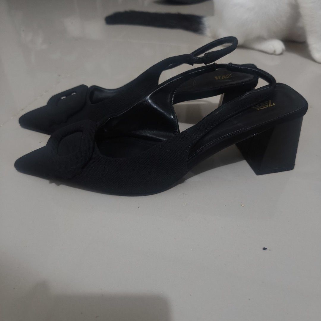 Black Zara Shoes Size 37 (Category: Flats & Sandals) located in Quezon City. Submitted by annethecoo17849 (Listing ID 1461895794, Image 3). Description: - Brand: Zara - Color: Black - Size: EU 37 (UK 4 / US 6) - Style: Slingback Heels - Features: Pointed toe, decorative buckle detail - Condition: Excellent (as pictured) barely used, has minor issue such as the fabric needs to be taped .
