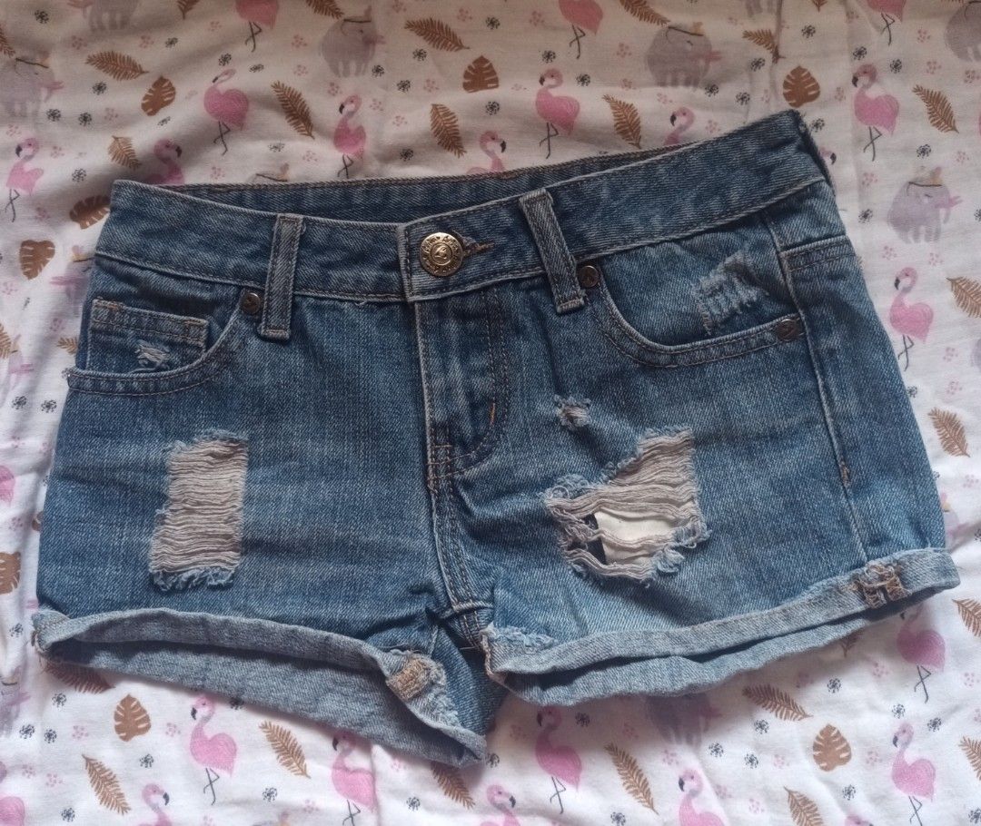 Blue Distressed Denim Shorts (Category: Shorts) located in Pasig City. Submitted by zeallion_149f0e (Listing ID 1461868651, Image 1). Description: - Cute blue denim shorts - Distressed details on front and back pockets - Cuffed hem - Ideal for casual wear - Effortlessly pairs with any top.