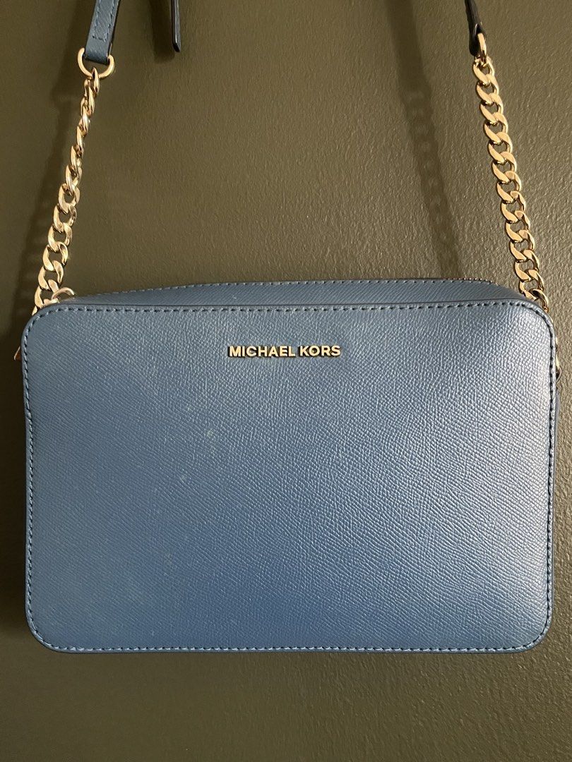 Blue Michael Kors Bag (Category: Cross-body Bags) located in Paranaque City. Submitted by colsness (Listing ID 1461845708, Image 2). Description: Orig from US has slight marks (as shown in the pics, but not noticeable when worn) Rfs : not using anymore.