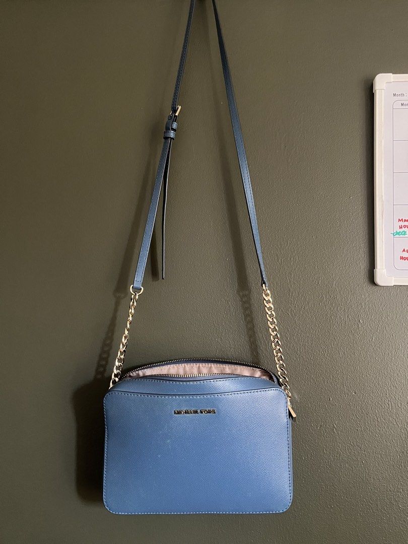 Blue Michael Kors Bag (Category: Cross-body Bags) located in Paranaque City. Submitted by colsness (Listing ID 1461845708, Image 1). Description: Orig from US has slight marks (as shown in the pics, but not noticeable when worn) Rfs : not using anymore.