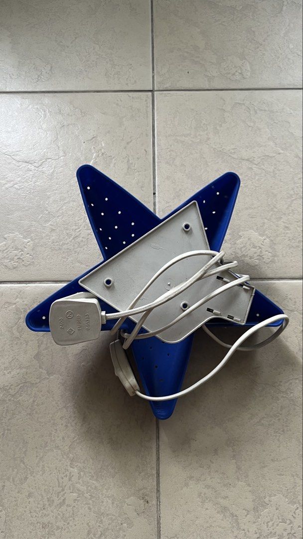 Blue Star Lamp with Plug (Category: Lighting) located in Manila. Submitted by tineemall (Listing ID 1461848721, Image 2). Description: - Unique blue star-shaped lamp - Features small holes all over for a diffused glow - Comes with a white cord and plug - Ideal for decorative purposes or as a soothing night light - Fully functional and works well ⚠️light not included ⚠️no light 📍Sta Mesa Manila ⚠️Buyer will shoulder the sfee .