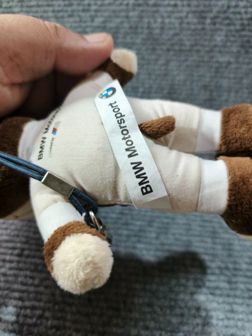 BMW Mascot Key chain doll (Category: Plushies & Soft Toys) located in San Leonardo. Submitted by burgossanleonardo.12345 (Listing ID 1461809988, Image 3). Description: - Adorable BMW Motorsport teddy bear plush toy. - Features a cool racing suit outfit. - Comes with a convenient keychain attachment. - Approximately 4-5 inches in size. - Ideal for BMW enthusiasts and collectors. - Perfect for decorating bags or keys..