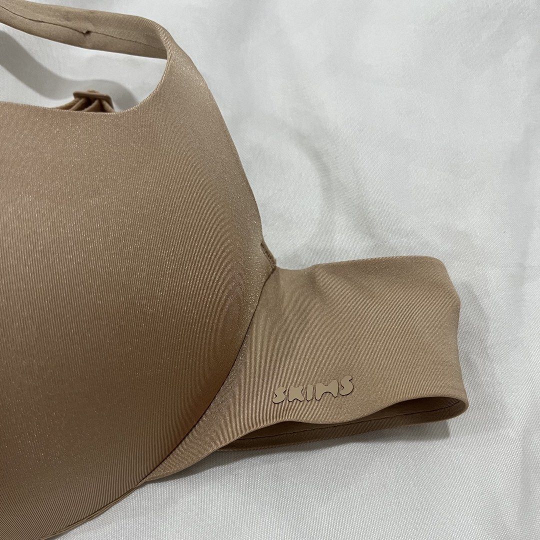 BNWT SKIMS Ultimate Push-Up Balconette Bra 34A Clay (Category: Undergarments & Loungewear) located in Quezon City. Submitted by selling.thingzzz (Listing ID 1461976744, Image 2). Description: - SKIMS Ultimate Push-Up Balconette Bra - Size: 34A - Color: Clay - Comfortable and supportive fit - Adjustable straps for versatile styling - Push-up design for lift and shape - Perfect for various outfits.