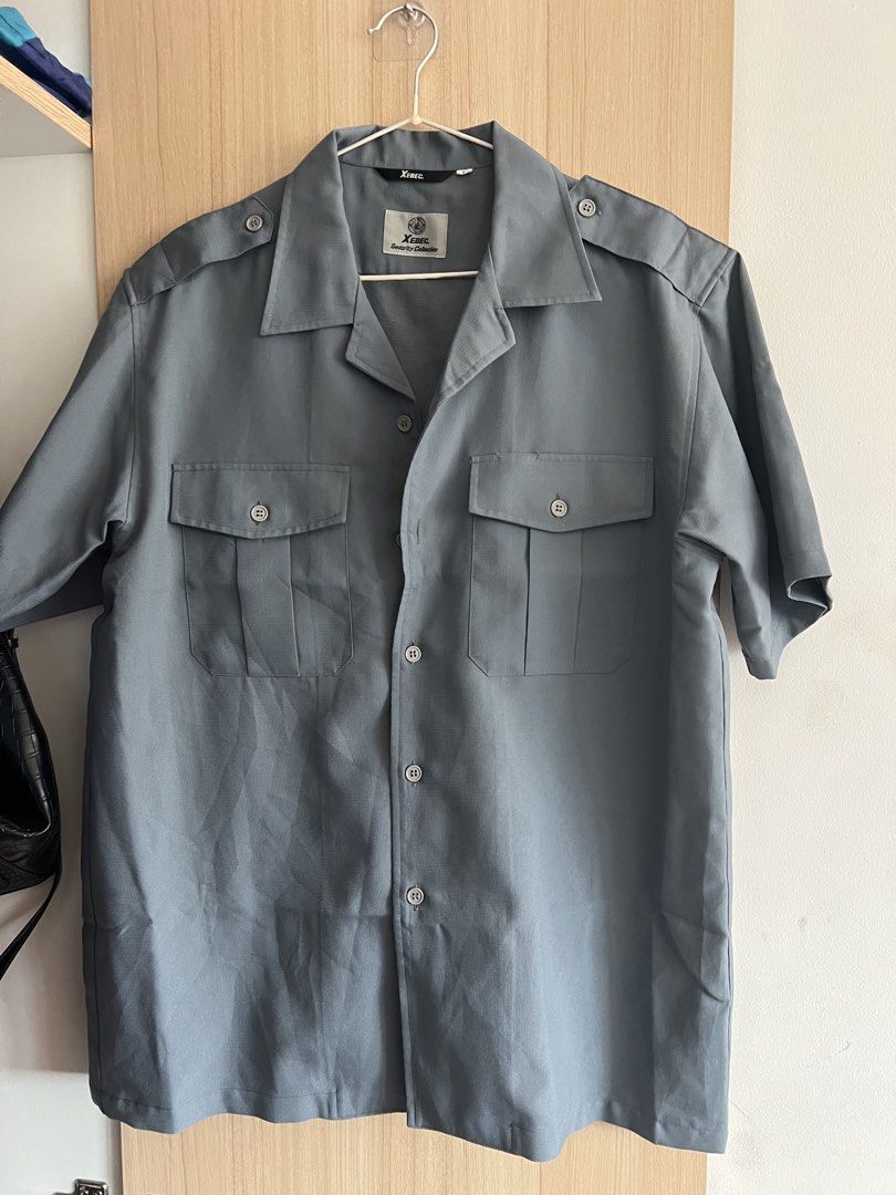 Boxy Short Sleeve Button Up Shirt Grey (Category: Tshirts & Polo Shirts ) located in Quezon City. Submitted by rvthlxss (Listing ID 1461848850, Image 1). Description: - Grey short sleeve button up shirt - Brand: Xenon - Two chest pockets with button closure - Shoulder epaulets - Classic collar - Versatile for work or casual wear - Mens Large on Tag.