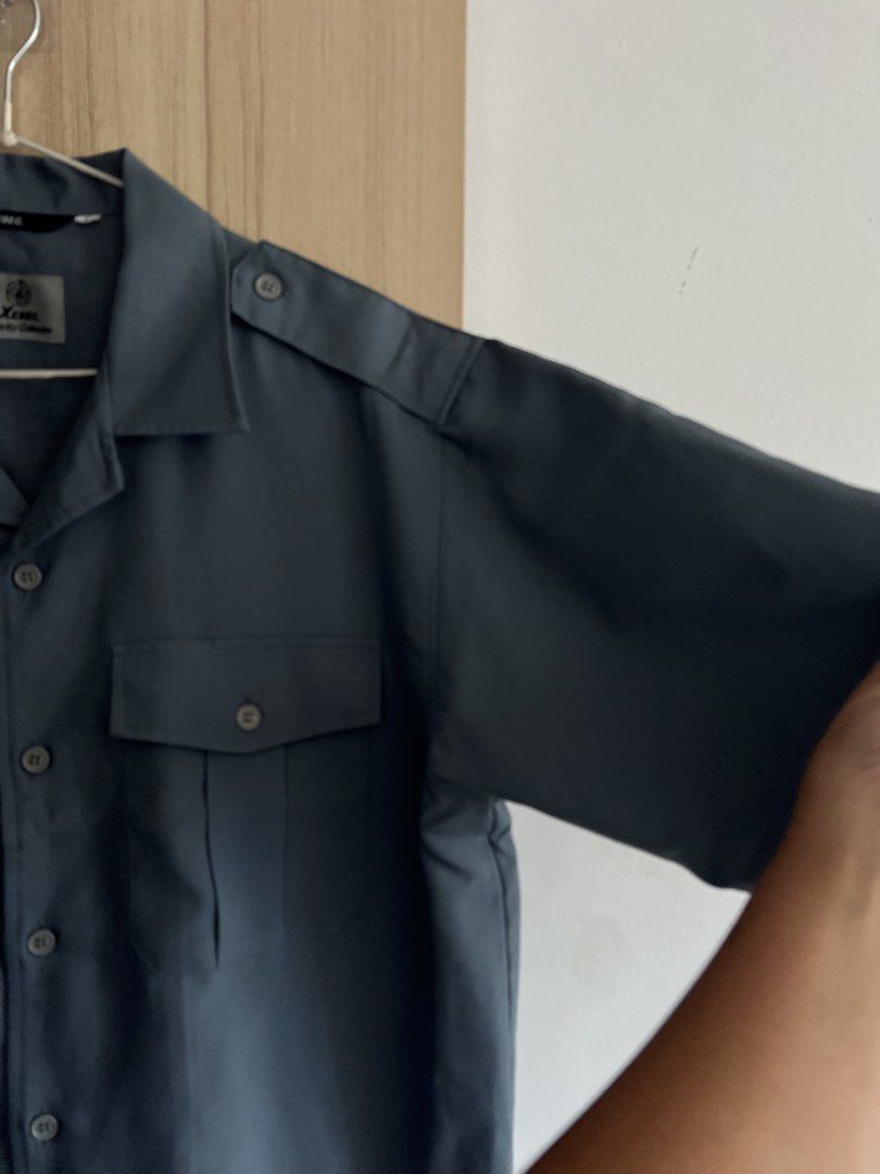 Boxy Short Sleeve Button Up Shirt Grey (Category: Tshirts & Polo Shirts ) located in Quezon City. Submitted by rvthlxss (Listing ID 1461848850, Image 3). Description: - Grey short sleeve button up shirt - Brand: Xenon - Two chest pockets with button closure - Shoulder epaulets - Classic collar - Versatile for work or casual wear - Mens Large on Tag.