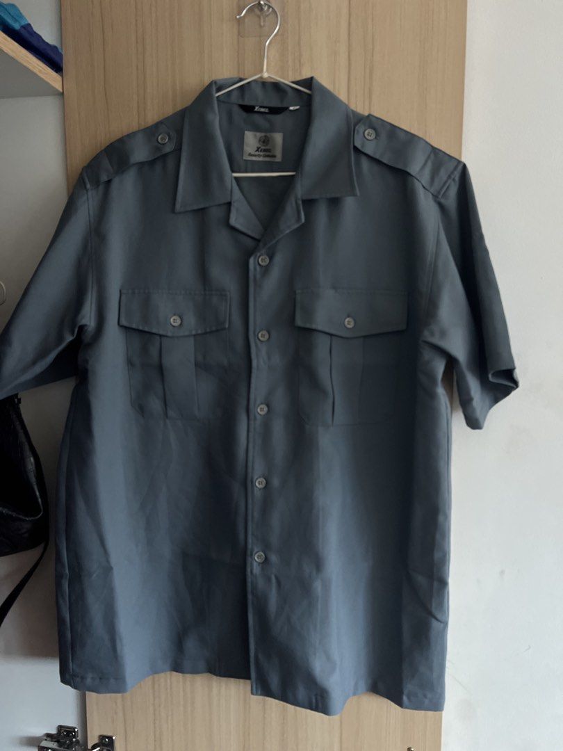 Boxy Short Sleeve Button Up Shirt Grey (Category: Tshirts & Polo Shirts ) located in Quezon City. Submitted by rvthlxss (Listing ID 1461848850, Image 2). Description: - Grey short sleeve button up shirt - Brand: Xenon - Two chest pockets with button closure - Shoulder epaulets - Classic collar - Versatile for work or casual wear - Mens Large on Tag.