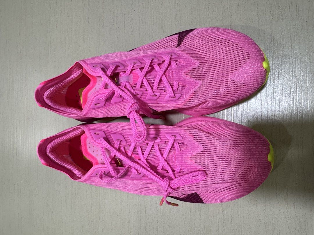 Brand New Vaporfly 4 (Category: Sneakers) located in Bacolor. Submitted by shopmystyle11 (Listing ID 1461874897, Image 2). Description: - Nike Vaporfly 4 - Condition: Brand New - Size: US 7.5 - Super lightweight racing shoes - Features ZoomX foam and carbon fiber plate for enhanced responsiveness - Vibrant pink color with lime green sole accents - Ideal for achieving your personal best in your next run or race.