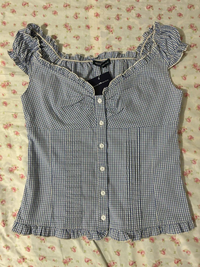 Brandy Melville Elara Top in Blue Gingham (Category: Sleeveless) located in Manila. Submitted by belly.blues (Listing ID 1461964937, Image 1). Description: Brandy Melville Elara Top in Blue Gingham rfs: not my style buy for ₱1,700!! - no lowballing - no when worn - can send more pics of the item payment method: gcash only shipping shouldered by buyer.