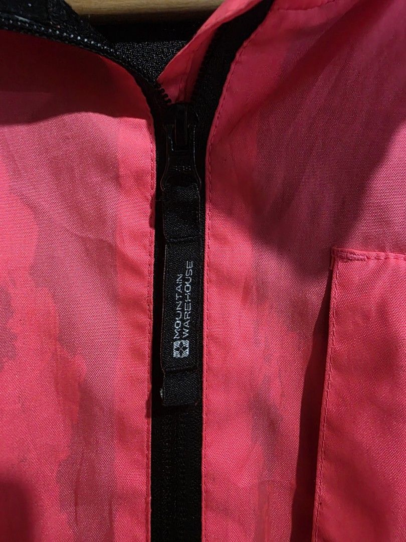 Bright Pink Windbreaker Jacket with Black Accents (Category: Coats, Jackets and Outerwear) located in Quezon City. Submitted by kick_mnl (Listing ID 1461865066, Image 2). Description: - Bright pink windbreaker jacket - Black collar and cuffs - Zipper closure with chest pocket - Reflective piping along seams - Lightweight material, ideal for outdoor activities - Minor marks on fabric (please check photos).
