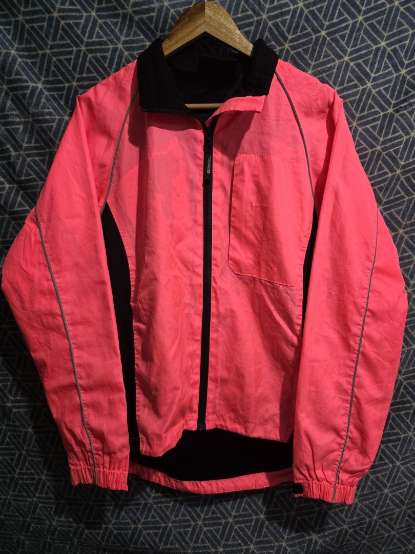 Bright Pink Windbreaker Jacket with Black Accents (Category: Coats, Jackets and Outerwear) located in Quezon City. Submitted by kick_mnl (Listing ID 1461865066, Image 1). Description: - Bright pink windbreaker jacket - Black collar and cuffs - Zipper closure with chest pocket - Reflective piping along seams - Lightweight material, ideal for outdoor activities - Minor marks on fabric (please check photos).