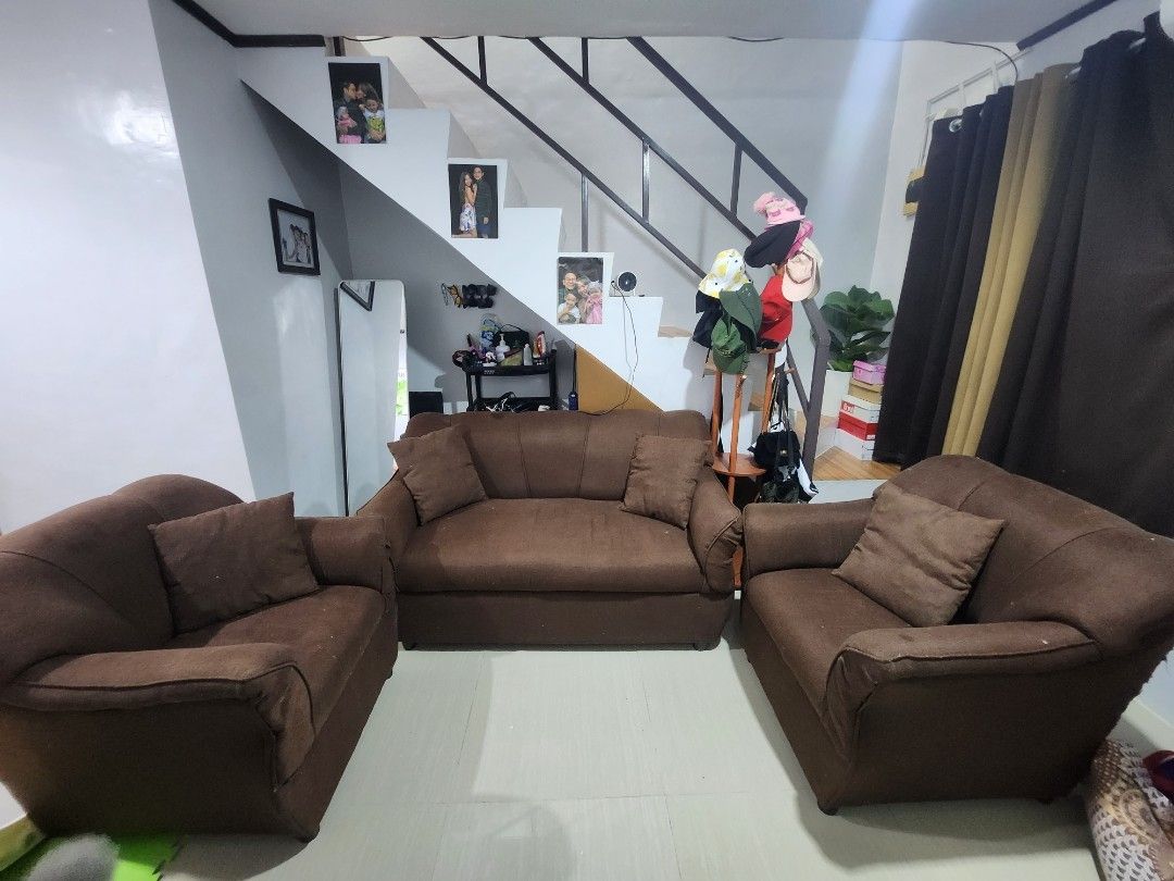 Brown Fabric Sofa Set - 3 Seater and 2 Single Chairs (Category: Sofas) located in Manila. Submitted by justyourordinarydude (Listing ID 1461914358, Image 2). Description: - Brown fabric sofa set - Includes one 3-seater sofa and two single chairs - Comfortable seating for your living room - Shows some wear and tear, especially on cushion edges (please check photos) - Still has plenty of life left - Pickup only.