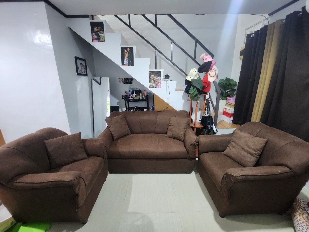 Brown Fabric Sofa Set - 3 Seater and 2 Single Chairs (Category: Sofas) located in Manila. Submitted by justyourordinarydude (Listing ID 1461914358, Image 1). Description: - Brown fabric sofa set - Includes one 3-seater sofa and two single chairs - Comfortable seating for your living room - Shows some wear and tear, especially on cushion edges (please check photos) - Still has plenty of life left - Pickup only.