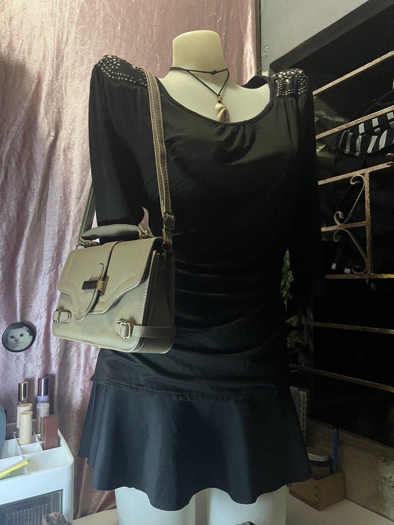 Brown Grey Slingbag with Gold Buckle (Category: Shoulder Bags) located in Rizal. Submitted by evermourn777 (Listing ID 1461957101, Image 1). Description: - leather material - magnet closure on front flap - no compartments inside - includes a long, adjustable strap.