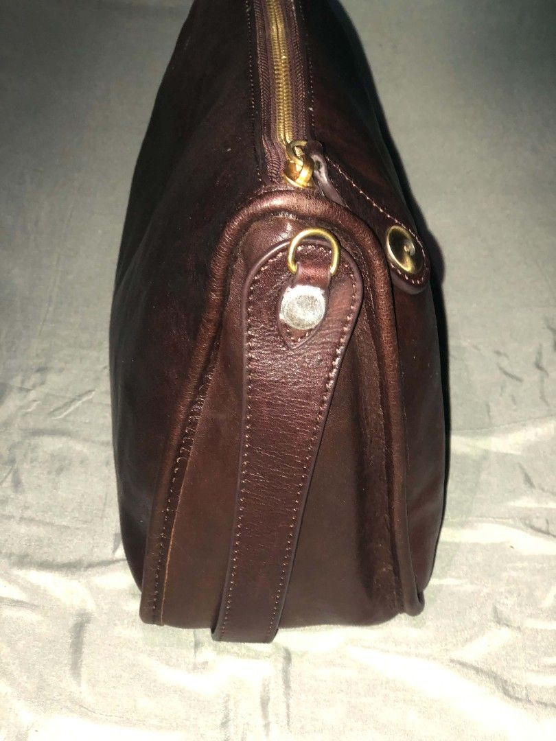 Brown Leather Shoulder Bag with Gold Hardware (Category: Shoulder Bags) located in Manila. Submitted by hollysansh (Listing ID 1461854939, Image 2). Description: - Classic brown leather shoulder bag -Genuine vintage leather - Secure zip closure - Elegant gold-tone hardware - Beautiful leather sheen - Lined interior - Adjustable strap for comfort - Ideal everyday bag.