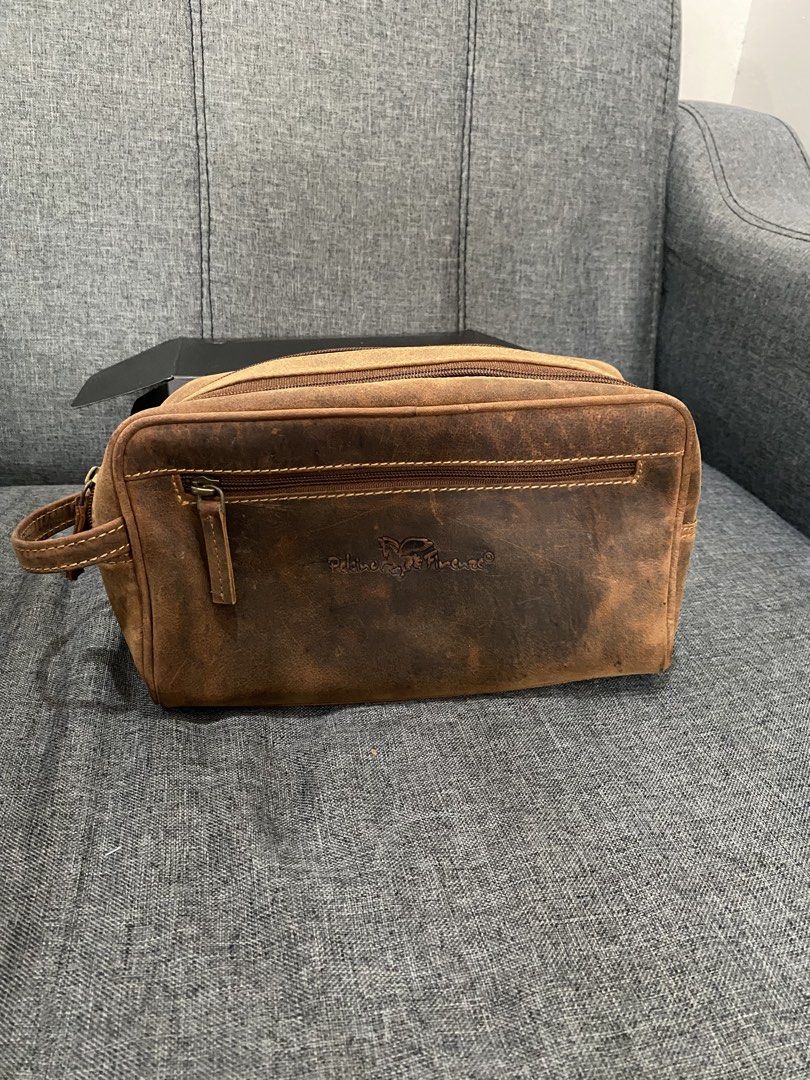 Brown Leather Toiletry Bag / Dopp Kit (Category: Belt bags, Clutches and Pouches) located in Rizal. Submitted by savannahthings (Listing ID 1461857201, Image 1). Description: - Genuine brown leather dopp kit - Features a main zippered compartment - Includes a front zippered pocket - Distressed leather finish for a stylish, vintage look - Ideal for travel or everyday organization.