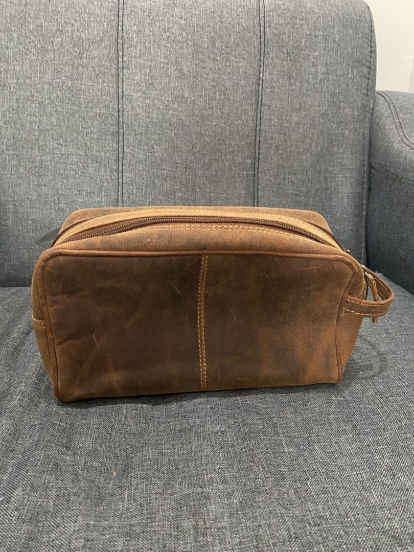 Brown Leather Toiletry Bag / Dopp Kit (Category: Belt bags, Clutches and Pouches) located in Rizal. Submitted by savannahthings (Listing ID 1461857201, Image 3). Description: - Genuine brown leather dopp kit - Features a main zippered compartment - Includes a front zippered pocket - Distressed leather finish for a stylish, vintage look - Ideal for travel or everyday organization.