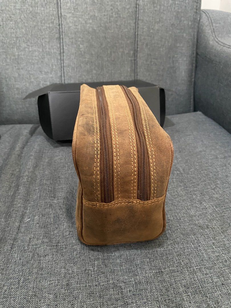 Brown Leather Toiletry Bag / Dopp Kit (Category: Belt bags, Clutches and Pouches) located in Rizal. Submitted by savannahthings (Listing ID 1461857201, Image 2). Description: - Genuine brown leather dopp kit - Features a main zippered compartment - Includes a front zippered pocket - Distressed leather finish for a stylish, vintage look - Ideal for travel or everyday organization.
