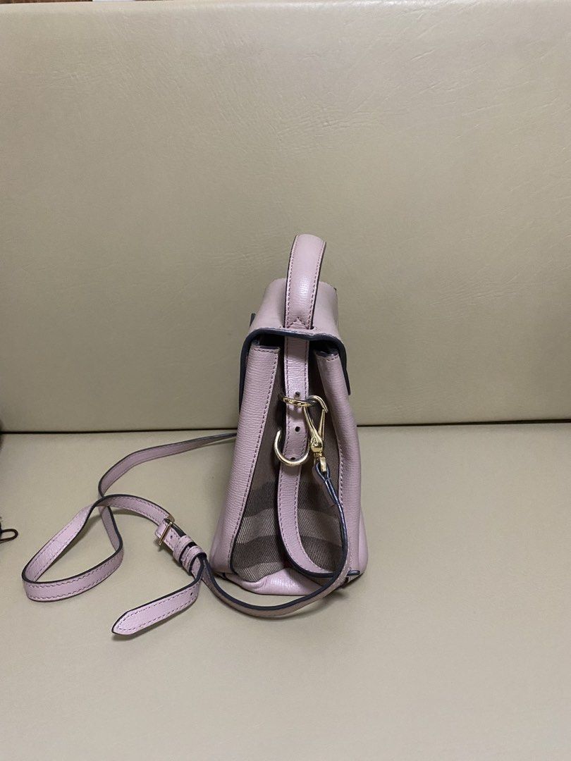 Burberry Leather Handbag with Shoulder Strap (Category: Luxury Bags & Wallets) located in Manila. Submitted by aikara683 (Listing ID 1461976798, Image 3). Description: - Light pink Burberry handbag - Textured leather material - Top handle and detachable shoulder strap - Gold buckle closure on front flap - Classic Burberry check lining - Versatile for everyday or special occasions - Authentic - hardware discoloration needs bag spa.