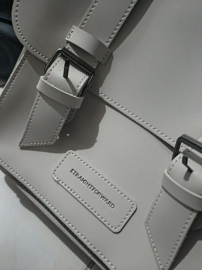 buy1take1 Straightforward Daily Vegan Leather Backpack - Light Grey (Category: Backpacks) located in Manila. Submitted by iamalex22 (Listing ID 1461917873, Image 2). Description: - Straightforward backpack in light grey. - Made from durable, stain-repellent, and water-resistant daily vegan leather. - Features front buckle straps. - Includes a top handle. - Ideal for everyday use. - Please check photos for more details. BLACK AT GRAY PO ITO DALAWA