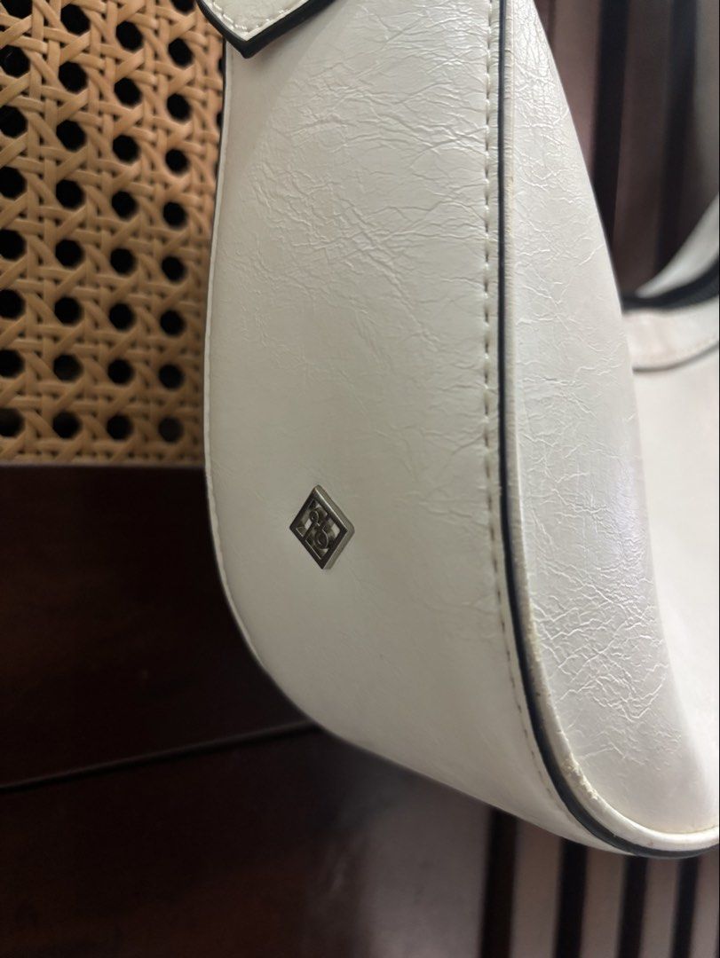 Call It Spring White Shoulder Bag (Category: Shoulder Bags) located in Trece Martires City. Submitted by decluttercloset_niks (Listing ID 1461910241, Image 3). Description: - zipper works properly 📍 Trece Martires, Cavite 💸 MOP: GCash / Metrobank 🛵 MOD: Lalamove • Pay first — buyer shoulders the delivery fee • For clothes, I do next-day delivery so I can properly prepare your order before sending it out..